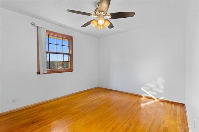 unfurnished room with wood-type flooring and ceiling fan