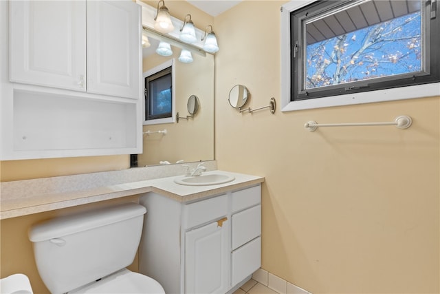 bathroom featuring toilet and vanity