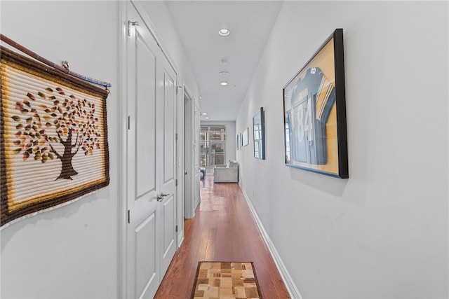 hall with dark hardwood / wood-style floors