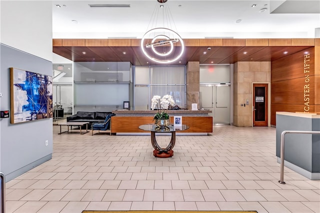 welcome area with an inviting chandelier