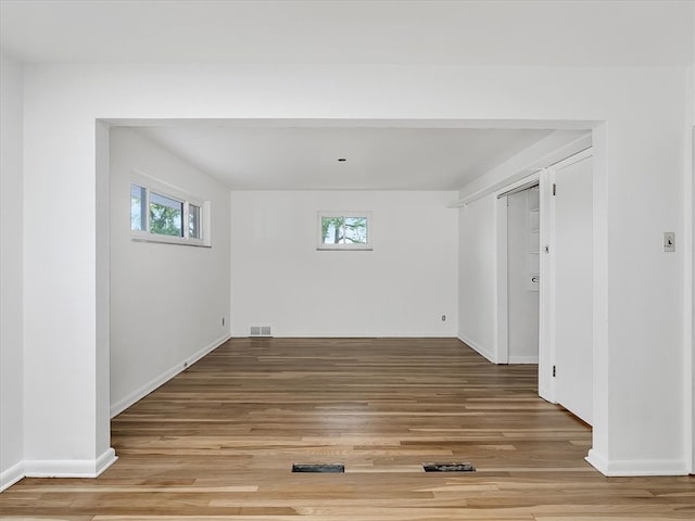 spare room with hardwood / wood-style flooring