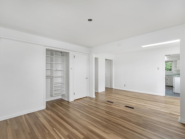 unfurnished bedroom featuring hardwood / wood-style flooring