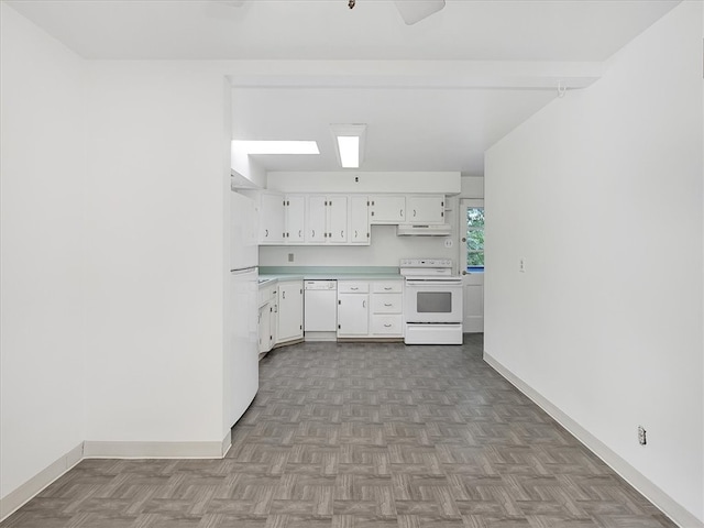 kitchen featuring white appliances, light parquet flooring, ventilation hood, and white cabinets