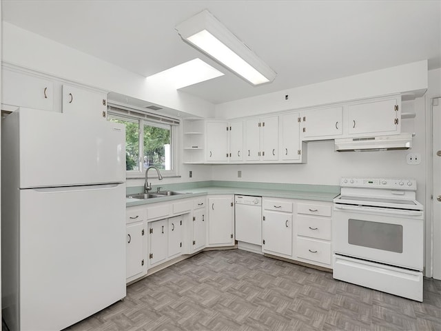 kitchen with sink, white cabinets, and white appliances