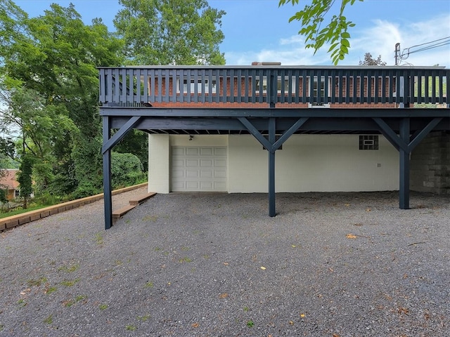 view of vehicle parking featuring a garage