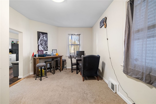 office space featuring indoor bar and carpet