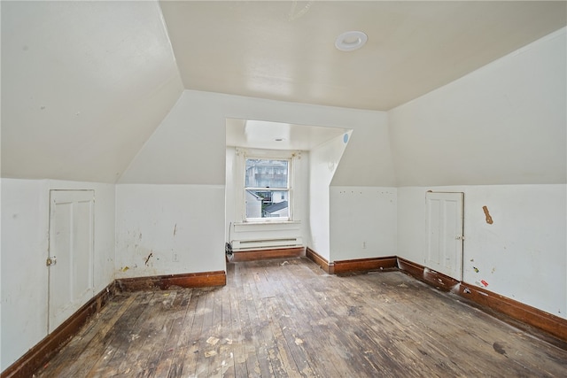 bonus room with a baseboard radiator, lofted ceiling, and dark hardwood / wood-style flooring