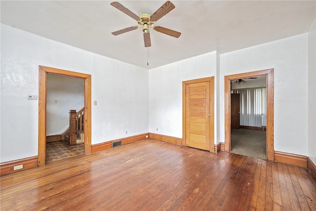 empty room with hardwood / wood-style flooring and ceiling fan