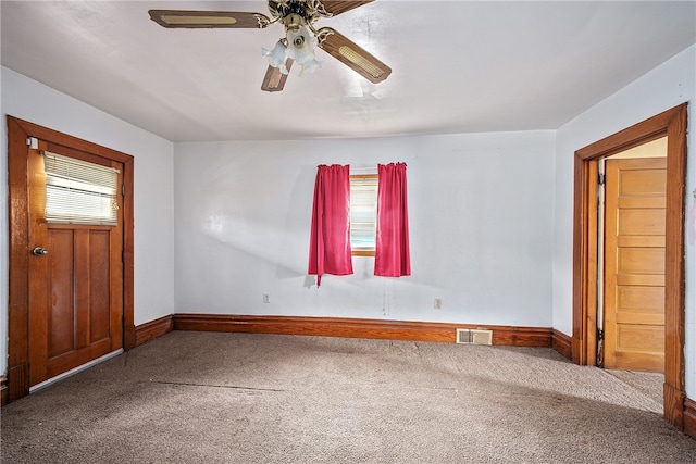 interior space featuring carpet floors and ceiling fan