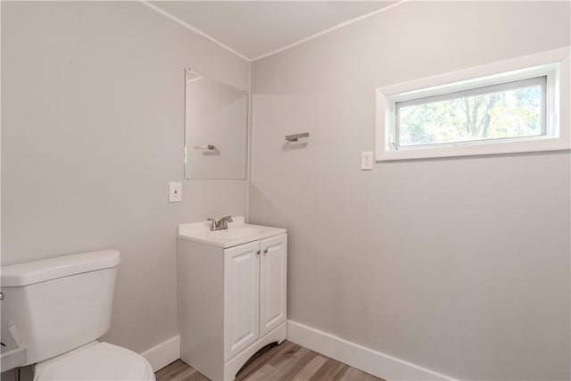 410 W Swissvale Ave, Edgewood, PA 15218 - half bathroom featuring toilet, baseboards, wood finished floors, and vanity