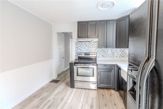 kitchen with light hardwood / wood-style floors, tasteful backsplash, appliances with stainless steel finishes, and ornamental molding