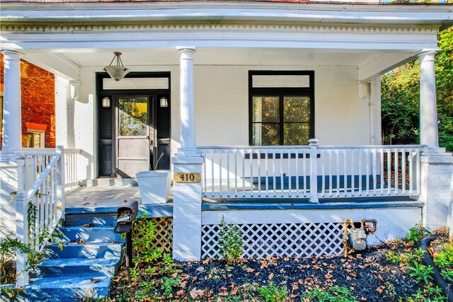 entrance to property with covered porch