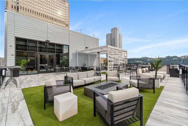 view of patio featuring an outdoor living space with a fire pit and a pergola