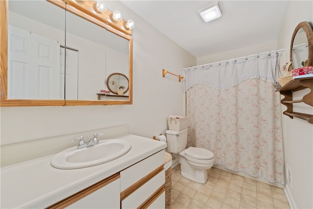 bathroom with vanity, toilet, and a shower with shower curtain