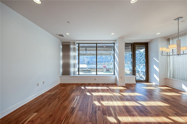 unfurnished room with dark wood-type flooring