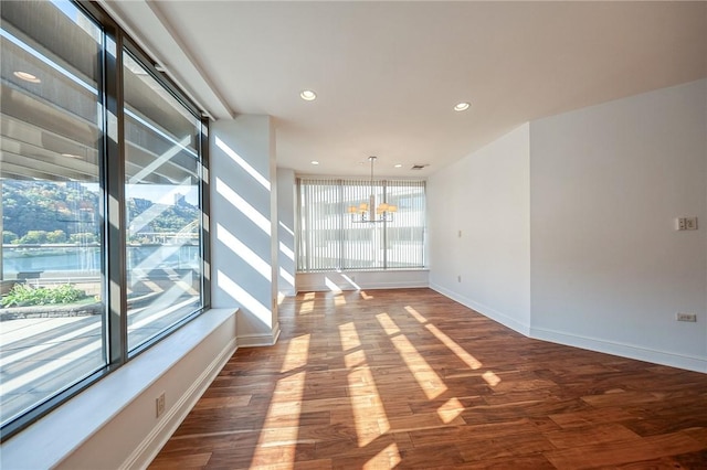 151 Fort Pitt Blvd Unit 401, Downtown Pgh, PA 15222 - unfurnished room featuring a chandelier, wood finished floors, recessed lighting, and baseboards