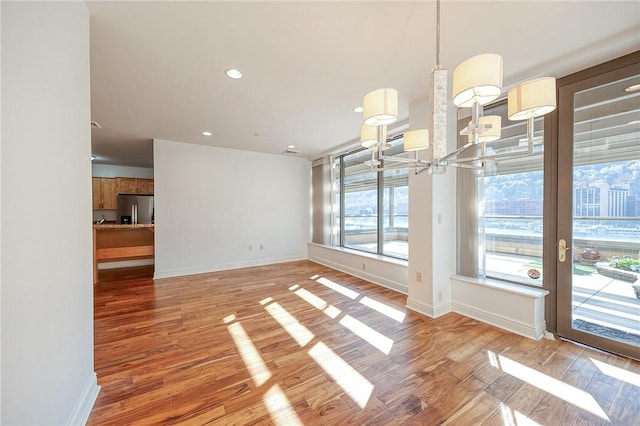 151 Fort Pitt Blvd Unit 401, Downtown Pgh, PA 15222 - unfurnished dining area featuring a chandelier, light wood-type flooring, baseboards, and recessed lighting