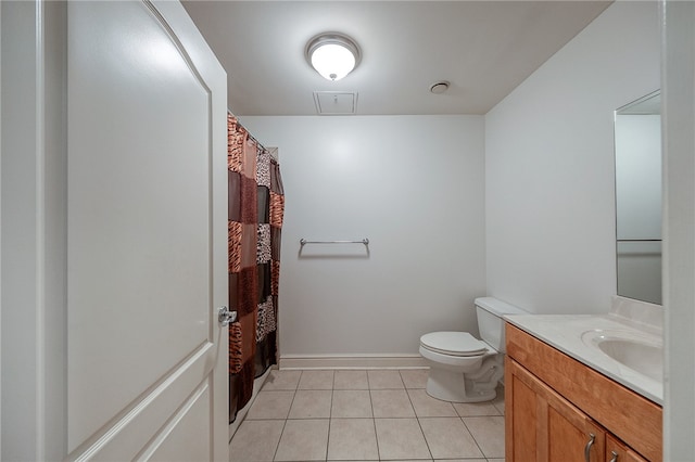 bathroom featuring vanity, toilet, tile patterned floors, and walk in shower