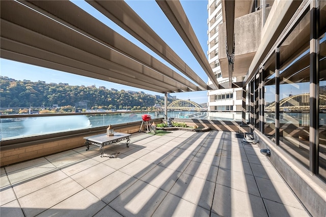 view of patio / terrace featuring a water view