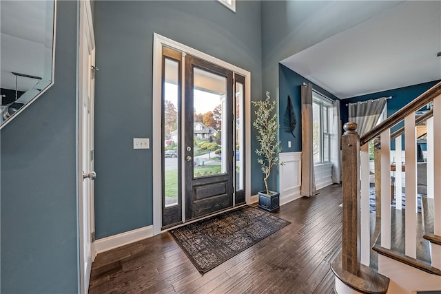 entryway with dark hardwood / wood-style flooring