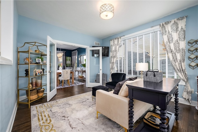 home office featuring french doors and dark hardwood / wood-style flooring