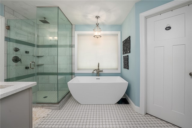 bathroom featuring vanity and shower with separate bathtub