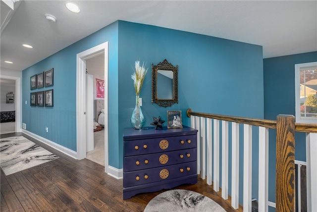 hallway with dark hardwood / wood-style floors