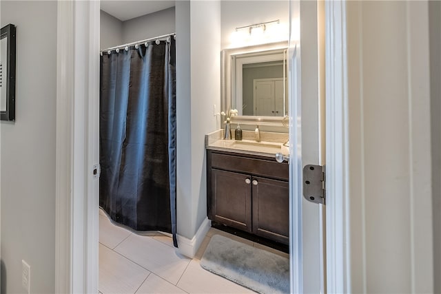 bathroom featuring vanity and tile patterned flooring