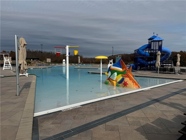 view of swimming pool featuring a patio area