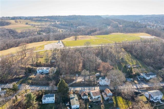 birds eye view of property with a rural view