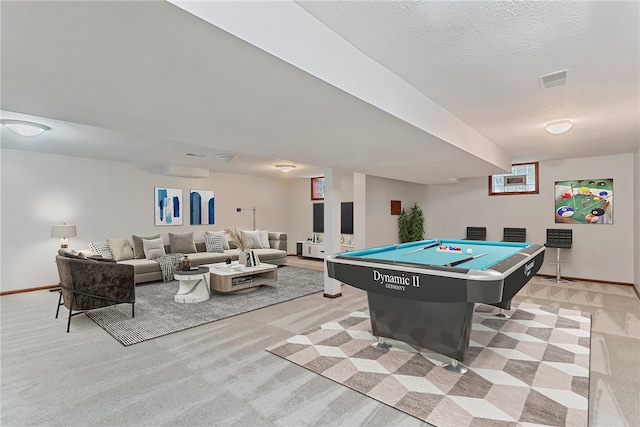 recreation room featuring a textured ceiling, light colored carpet, and billiards