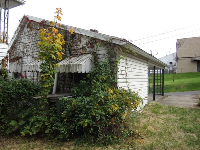 view of property exterior featuring a yard