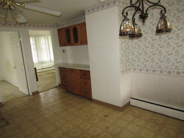 kitchen with a baseboard heating unit and ceiling fan