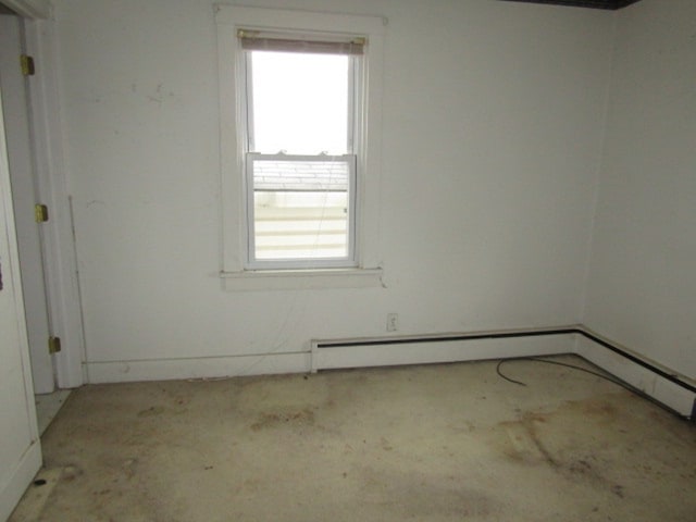 spare room with baseboard heating