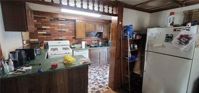 kitchen featuring sink and white appliances