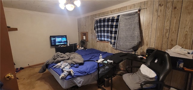 bedroom featuring carpet floors and wooden walls