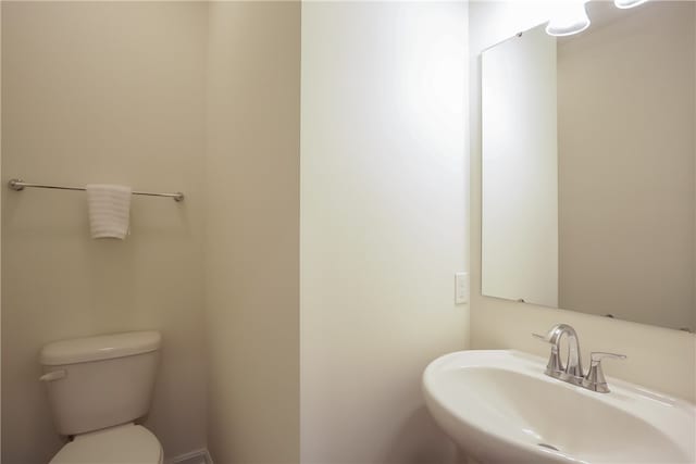 bathroom with sink and toilet