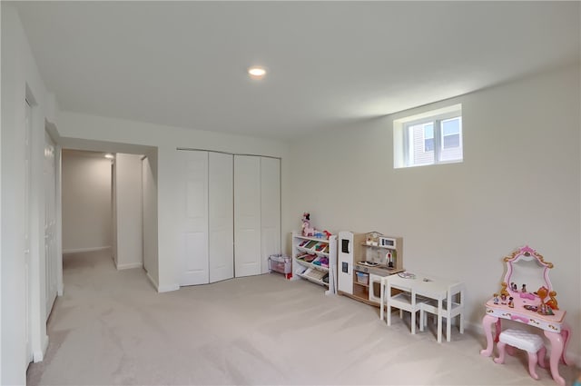 playroom featuring light colored carpet