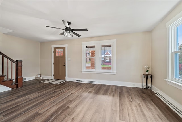 entryway featuring hardwood / wood-style flooring, a wealth of natural light, and baseboard heating