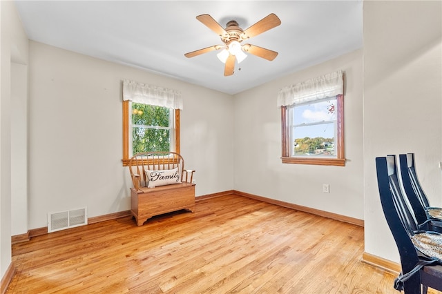 interior space featuring ceiling fan, light hardwood / wood-style floors, and plenty of natural light