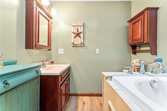 bathroom with vanity and hardwood / wood-style flooring