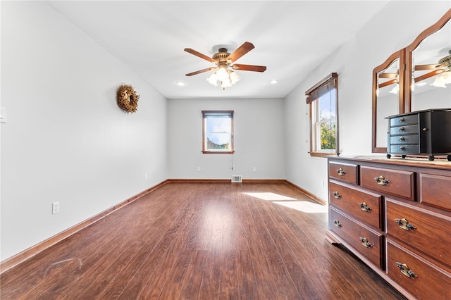 unfurnished bedroom featuring dark hardwood / wood-style flooring