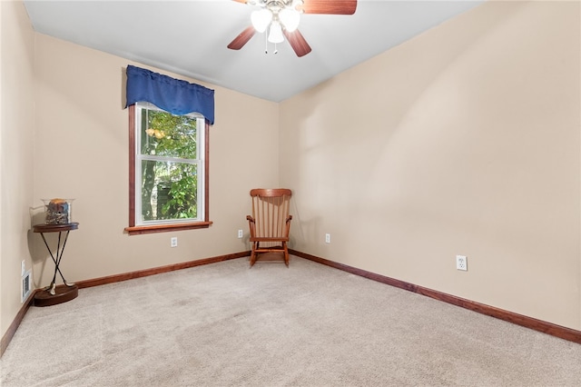 empty room featuring carpet flooring and ceiling fan