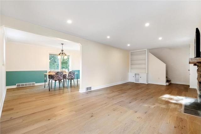 unfurnished living room with light wood-type flooring