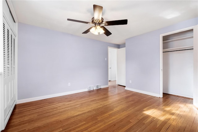 unfurnished bedroom with wood-type flooring and ceiling fan