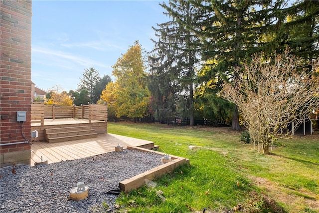 view of yard featuring a wooden deck