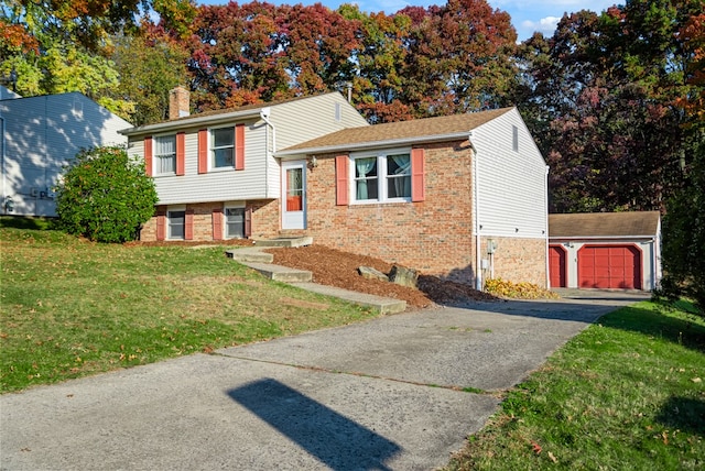 tri-level home featuring a front yard and a garage