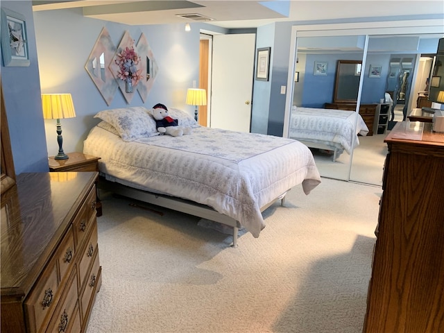 carpeted bedroom with a closet