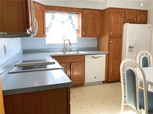 kitchen with sink and white appliances