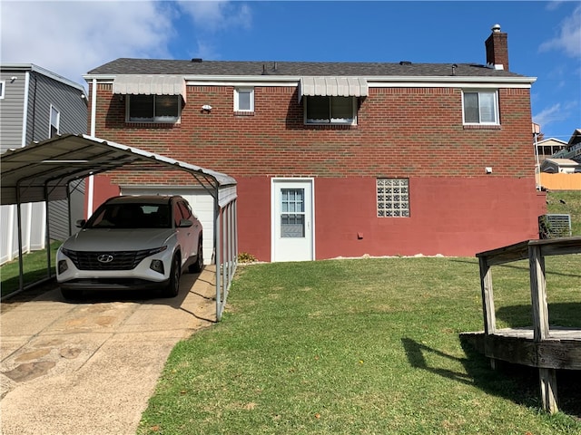 view of front of house with a front yard and a carport